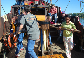 The crew walks the capstan.