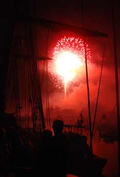 An animated clip of silhouetted Half Moon crew watching the fireworks finale.