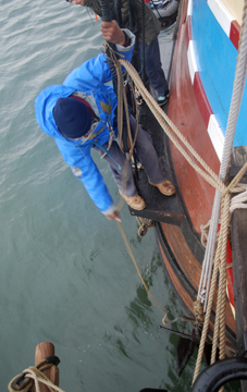 Bill Stevens pulls the fid, releasing the anchor.