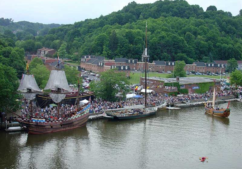 Ships docked at riverside festival