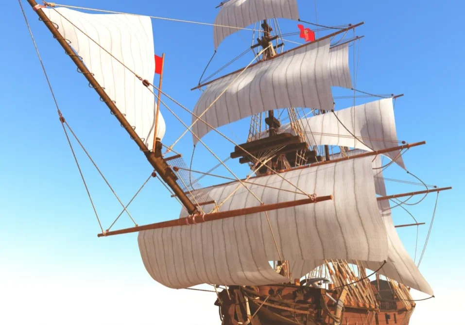 Vintage wooden ship against blue sky