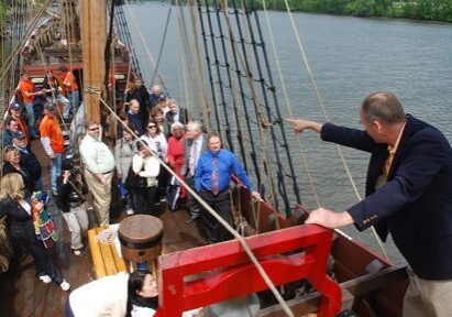People on a historic ship deck